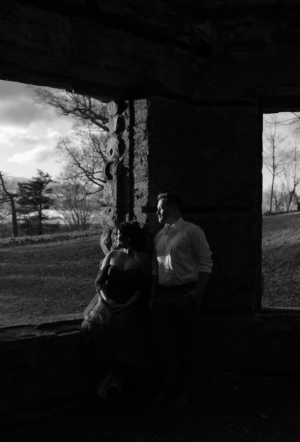 black and white romantic engagement photos at a castle 