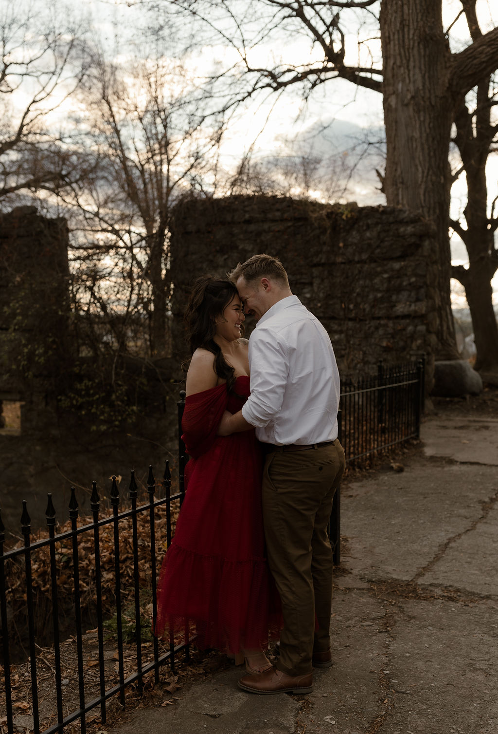 a couple smiling together for their romantic Engagement Photos