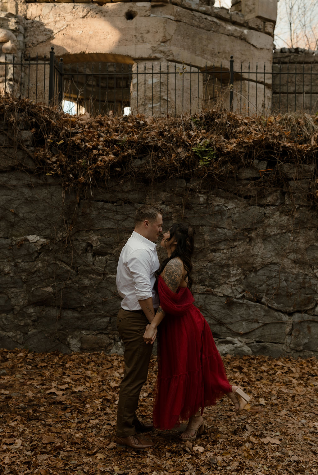 newly engaged couple posing in front of a castle for their Massachusetts Engagement Photographer