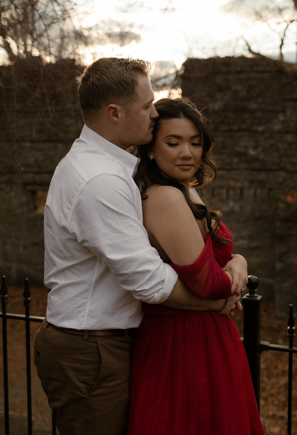 a man and woman embracing during their romantic Massachusetts Engagement Photos