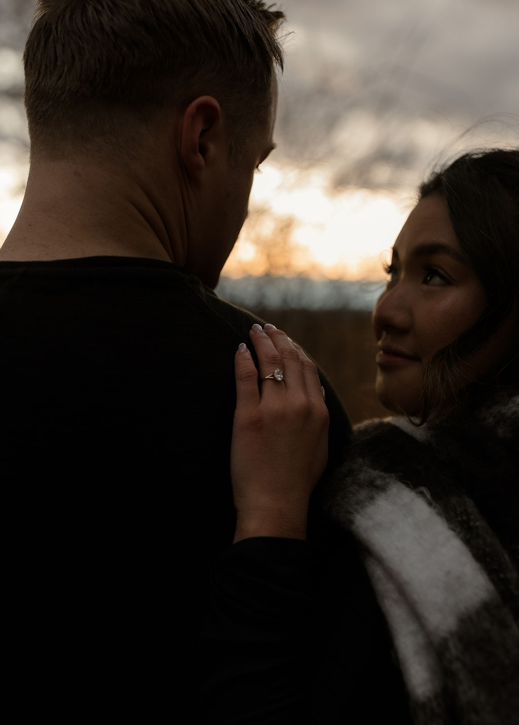 a woman looking up at her fiance during their Massachusetts Engagement Photos