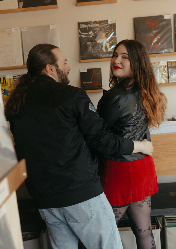 girl looking over her shoulder in record store