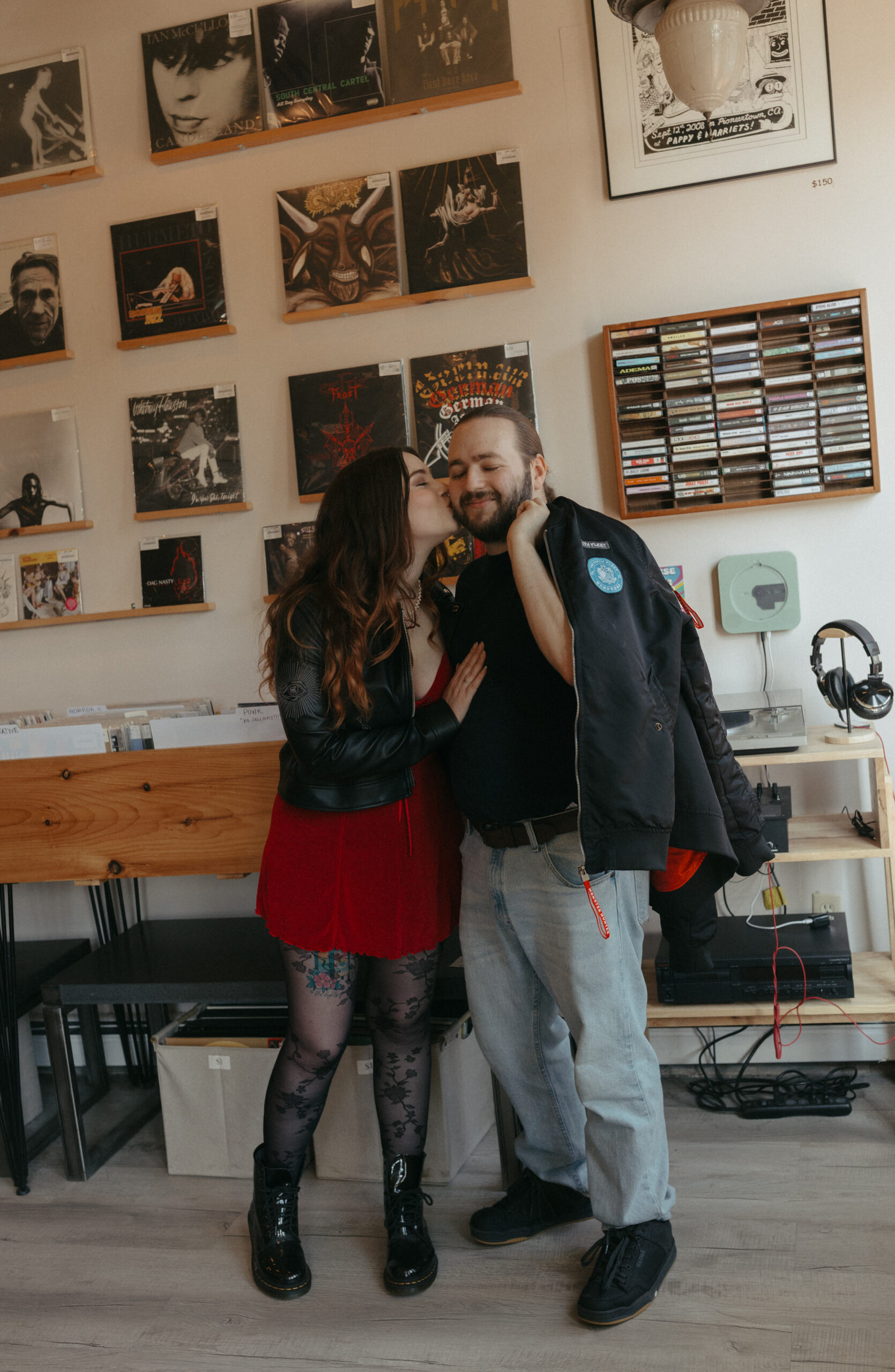 couples kissing at a record store